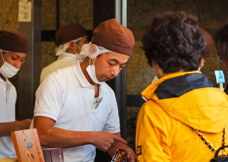 FUKUOKA, JAPAN - NOVEMBER 13: Japanese sweet in Fukuoka, Japan on November 13, 2013. Unidentified male shop keeper sells a plate of japanese sweets in his shop nearby Dazaifu Tenmanguのeditorial素材