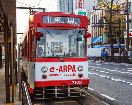 OKAYAMA, JAPAN - NOVEMBER 17  Okayama Street car in Okayama, Japan on November 17, 2013  Only cover a small area in central Okayama city  1 day pass available for 400 Yenのeditorial素材