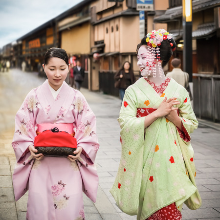 KYOTO, JAPAN - NOVEMBER 18  Maiko in Kyoto, Japan on November 18, 2013  Apprentice geisha in western Japan, especially Kyoto  Their jobs consist of performing songs, dances, and playing the shamisenのeditorial素材