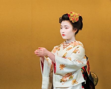 KYOTO, JAPAN - NOVEMBER 18  Kyomai Dance  in Kyoto, Japan on November 18, 2013  Unidentified Geisha performs Kyomai dance which adopted the elegance and of the imperial court mannerのeditorial素材