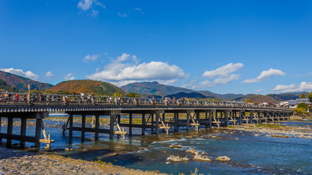 KYOTO, JAPAN - NOVEMBER 19  Togetsukyo in Kyoto, Japan on November 19, 2013  Togetsu-kyo Bridge is a landmark over 400 years, spans the Katsura River in front of Arashiyama Mountainのeditorial素材