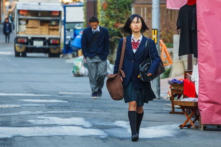 KYOTO, JAPAN - NOVEMBER 20  Japanese Student in Kyoto, Japan on November 20, 2013  Unidentified female Japanese student travels to school in the morningのeditorial素材