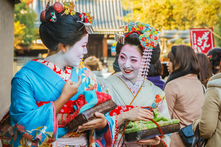 KYOTO, JAPAN - NOVEMBER 20  Maiko in Kyoto, Japan on November 20, 2013  Apprentice geisha in western Japan, especially Kyoto  Their jobs consist of performing songs, dances, and playing the shamisenのeditorial素材