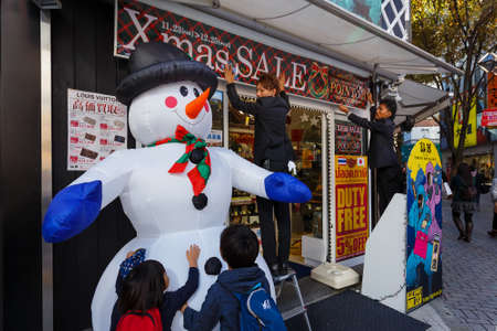 TOKYO, JAPAN - NOVEMBER 23  Christmas in Tokyo, Japan on November 23, 2013  A Shop at Shinjuku area decorated with a snowman and prepare for the up coming christmasのeditorial素材