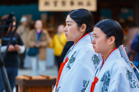TOKYO, JAPAN - NOVEMBER 23  Wedding ceremony in Tokyo, Japan on November 23, 2013  Priestesses lead groom and bride in a traditional wedding ceremony at Meiji shrineのeditorial素材