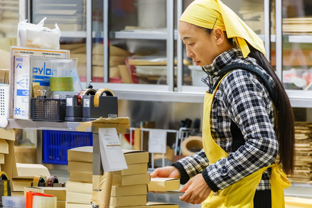 TOKYO, JAPAN - NOVEMBER 25  Tsukiji fish market in Tokyo, Japan on November 25, 2013  Unidentified japanese female worker prepares for the shop openning in the morningのeditorial素材