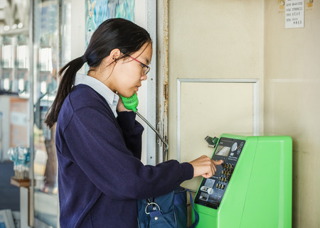 KAMAKURA, JAPAN - NOVEMBER 24  Coin operated telephone in Kamakura, Japan on November 24, 2013  Public telephone can be found in many train station in Japanのeditorial素材