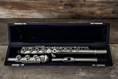 Modern Concert Flute on a Wood Table