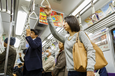 KYOTO, JAPAN - OCTOBER 21: Subway Commuter in Kyoto, Japan on October 21, 2014. Unidentified Japanese subway commuters catch a train to work in the morningのeditorial素材