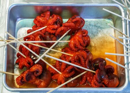 Boiled Tiny Octopus sold at Nishiki Market in Kyotoの写真素材