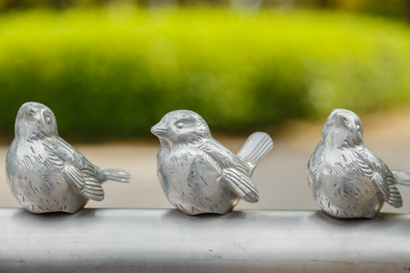 Small Bird Sculptures on a Handrail at Osaka Castle Parkのeditorial素材