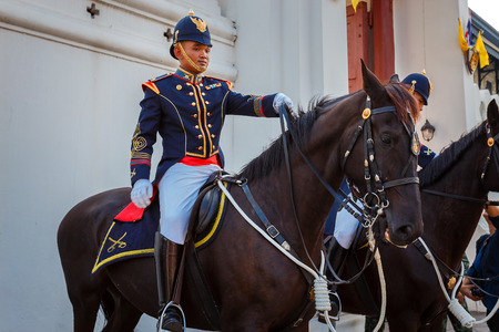 BANGKOK, THAILAND - DECEMBER 19: Wat Phra Kaew in Bangkok, Thailand on December 19, 2014. Unidentified Royal Horse Guards are on duty at Thai grand palaceのeditorial素材