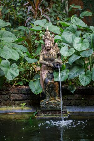 Typical Thai Garden with a fountain and a Small Pond