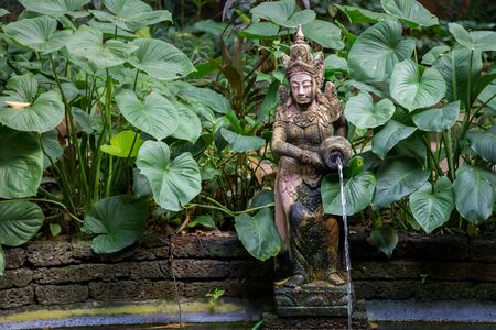 Typical Thai Garden with a fountain and a Small Pondの写真素材