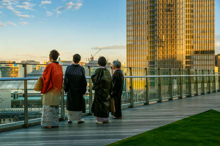 TOKYO, JAPAN - NOVEMBER 15, 2015: Unidentified Japanese women with traditional Kimono dresses are on the roof garden of Kitte Marunouchi shopping mallのeditorial素材