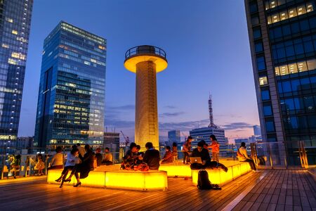 TOKYO, JAPAN - NOVEMBER 15, 2015: Unidentified people are on the roof garden of Kitte Marunouchi...