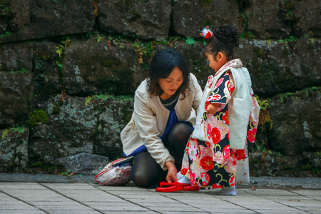 Nikko, Japan - November 17 2015: Parents and Children at Toshogu shrine in a Traditional rite of passage and festival day in Japan for 3 and 7-year-old girls and 3 and 5-year-old boysのeditorial素材