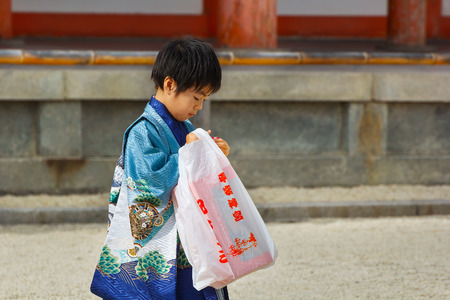 KYOTO, JAPAN - NOVEMBER 22 2015: Shichi-go-san, a traditional rite of passage and festival day in Japan for 3 and 7-year-old girls and 3 and 5-year-old boys at Heian-jingu Shrineのeditorial素材