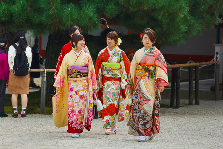 JAPAN - NOVEMBER 22 2015: Beautiful Japanese ladies in traditional kimono dress at Heian-jingu shrine, kyotoのeditorial素材