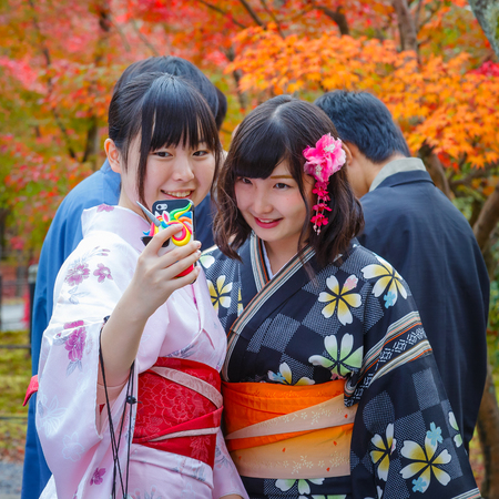 KYOTO, JAPAN - NOVEMBER 22 2015: Unidentified young Japanese women take selfie with a mobilephoneのeditorial素材