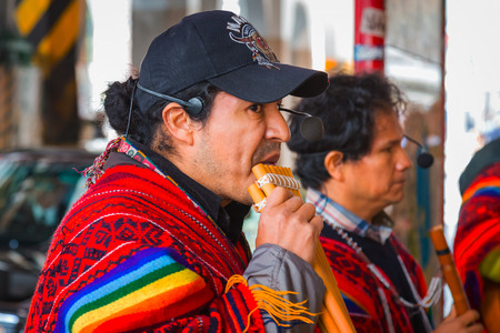 TOKYO, JAPAN - NOVEMBER 26 2015: Unidentified group of Peruvian Street Musicians perform traditional music for people at Uneno stationのeditorial素材