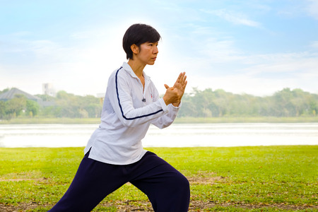 BANGKOK, THAILAND - FEBRUARY 20, 2016: Unidentified group of people practice  Tai Chi Chuan in a parkのeditorial素材