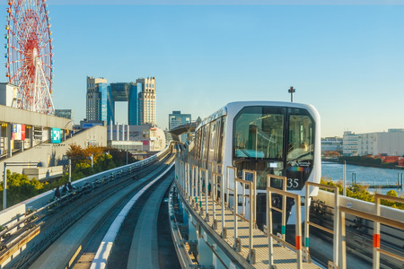 Motion blur of train moving inside tunnel in Odaiba, Tokyo, Japan                                                       TOKYO, JAPAN - NOVEMBER 27 2015: Cityscape from Yurikamome monorail sky train in Odaiba, the artificial island in Tokyoのeditorial素材