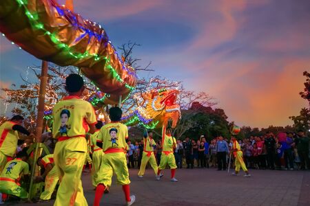 BANGKOK, THAILAND - FEBUARY 20: A group of people perform a dragon dance during Chinese new year's...