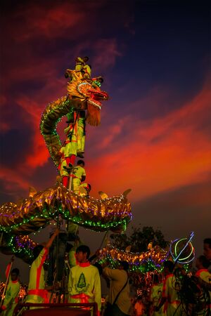 BANGKOK, THAILAND - FEBUARY 20: A group of people perform a dragon dance during Chinese new year's celebrationのeditorial素材