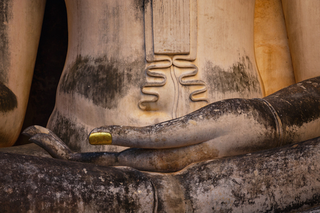 Seated Buddha image at  Wat Si Chum temple in Sukhothai Historical Park, a UNESCO world heritage site, Thailandの写真素材