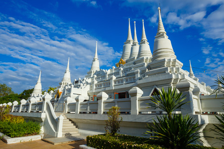 Elaborated white Buddhist Pagoda with multiple spires at Wat Asokara Temple in Thailandの写真素材