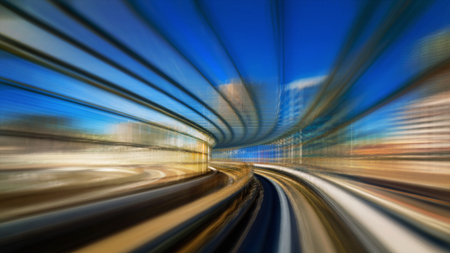 Motion blur of train moving inside tunnel in Odaiba, Tokyo, Japanの写真素材