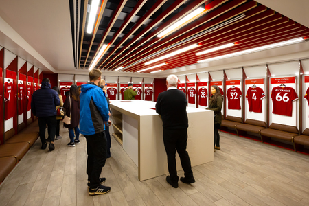LIVERPOOL, UNITED KINGDOM - MAY 17 2018: LFC staffs and a group of its football fans take a tour in Anfield stadium, the home ground of Liverpool football clubのeditorial素材