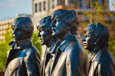 Liverpool, UK - May 17 2018: Bronze statue of the  Beatles stands at the Pier Head on the side of River Mersey, sculpted by Andrew Edwards and erected in December 2015のeditorial素材