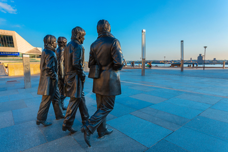 Liverpool, UK - May 17 2018: Bronze statue of the  Beatles stands at the Pier Head on the side of River Mersey, sculpted by Andrew Edwards and erected in December 2015のeditorial素材