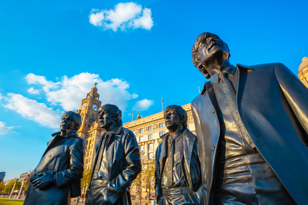 Liverpool, UK - May 17 2018: Bronze statue of the  Beatles stands at the Pier Head on the side of River Mersey, sculpted by Andrew Edwards and erected in December 2015のeditorial素材