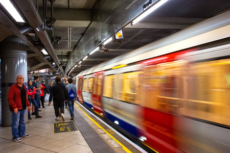 London, UK - May 13 2018: Unidentified people travel through underground train network in Londonのeditorial素材