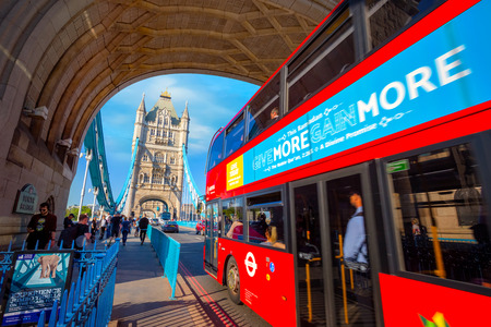 London, UK - May 14 2018: Tourist bus crosses Tower bridge over the River Thames in the city of Londonのeditorial素材