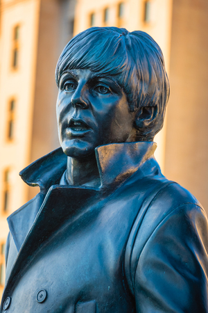 Liverpool, UK - May 17 2018: Bronze statue of the  Beatles stands at the Pier Head on the side of River Mersey, sculpted by Andrew Edwards and erected in December 2015のeditorial素材