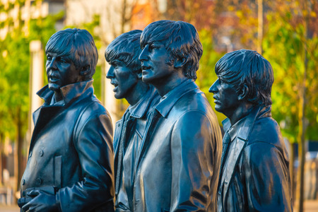 Liverpool, UK - May 17 2018: Bronze statue of the  Beatles stands at the Pier Head on the side of River Mersey, sculpted by Andrew Edwards and erected in December 2015のeditorial素材