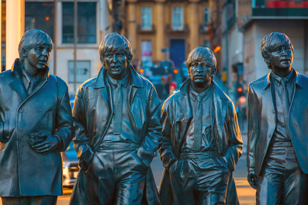 Liverpool, UK - May 17 2018: Bronze statue of the  Beatles stands at the Pier Head on the side of River Mersey, sculpted by Andrew Edwards and erected in December 2015のeditorial素材