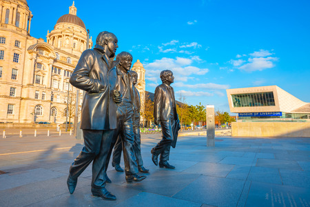 Liverpool, UK - May 17 2018: Bronze statue of the  Beatles stands at the Pier Head on the side of River Mersey, sculpted by Andrew Edwards and erected in December 2015のeditorial素材