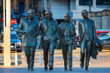 Liverpool, UK - May 17 2018: Bronze statue of the  Beatles stands at the Pier Head on the side of River Mersey, sculpted by Andrew Edwards and erected in December 2015のeditorial素材