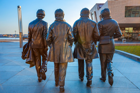 Liverpool, UK - May 17 2018: Bronze statue of the  Beatles stands at the Pier Head on the side of River Mersey, sculpted by Andrew Edwards and erected in December 2015のeditorial素材