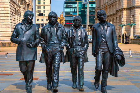Liverpool, UK - May 17 2018: Bronze statue of the  Beatles stands at the Pier Head on the side of River Mersey, sculpted by Andrew Edwards and erected in December 2015のeditorial素材