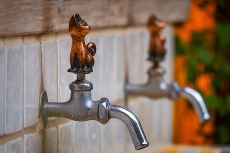 Tokyo, Japan - April 29 2018: Cat figure character on taps at Ghibli museum in Mikataのeditorial素材