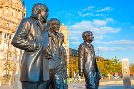 Liverpool, UK - May 17 2018: Bronze statue of the  Beatles stands at the Pier Head on the side of River Mersey, sculpted by Andrew Edwards and erected in December 2015のeditorial素材