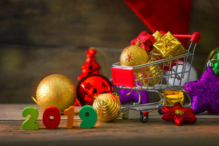 Christmas and New Year Background With Miniature Shopping Cart with Decorationsの写真素材