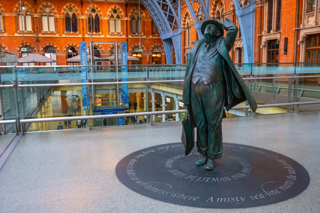 London, UK - May 14 2018: The Betjeman statue of sir John Betjeman the man who save St. Pancras station from demolition in the 1960's London, UK - May 14 2018: The Betjeman statue of sir John Betjeman the man who save St. Pancras station from demolition in the 1960's