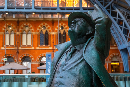 London, UK - May 14 2018: The Betjeman statue of sir John Betjeman the man who save St. Pancras station from demolition in the 1960's London, UK - May 14 2018: The Betjeman statue of sir John Betjeman the man who save St. Pancras station from demolition in the 1960's